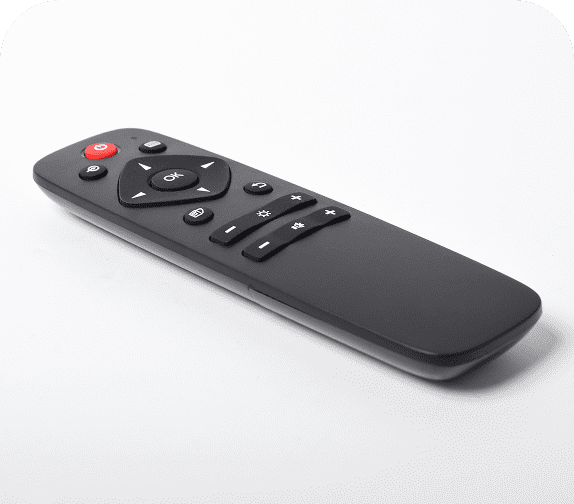 Black TV remote on white background